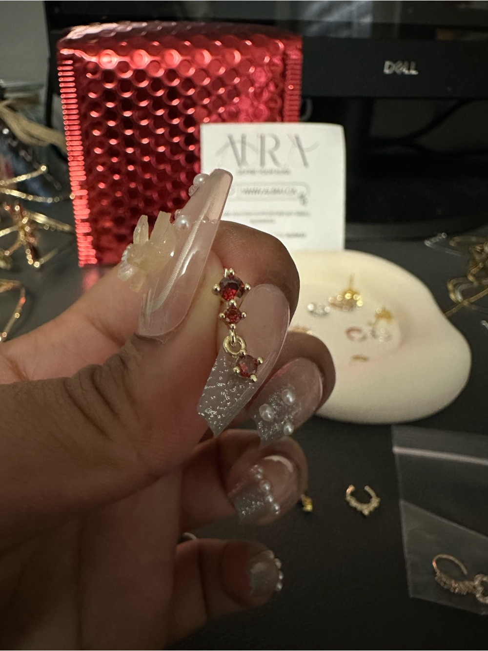 Gold and ruby dangle nose stud